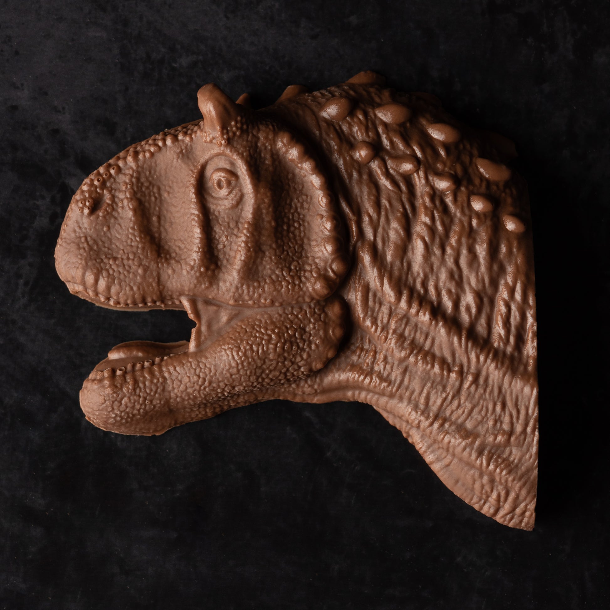 A T-Rex head made out of chocolate.
