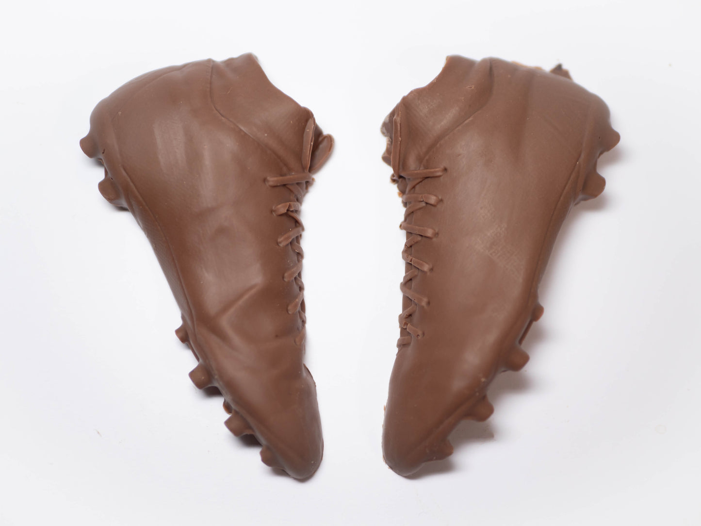 A pair of football boots made out of chocolate.
