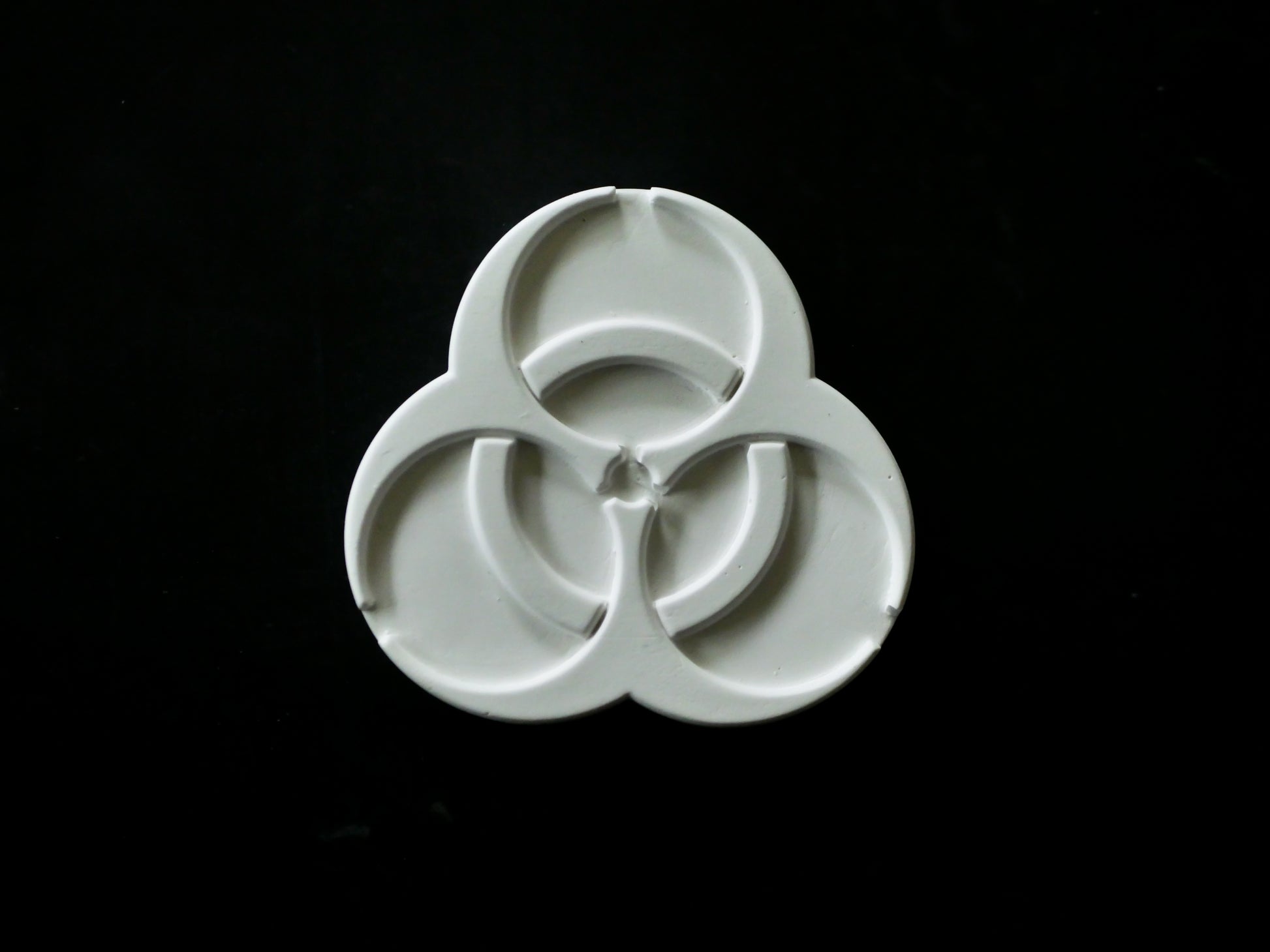 Biohazard symbol on a black background