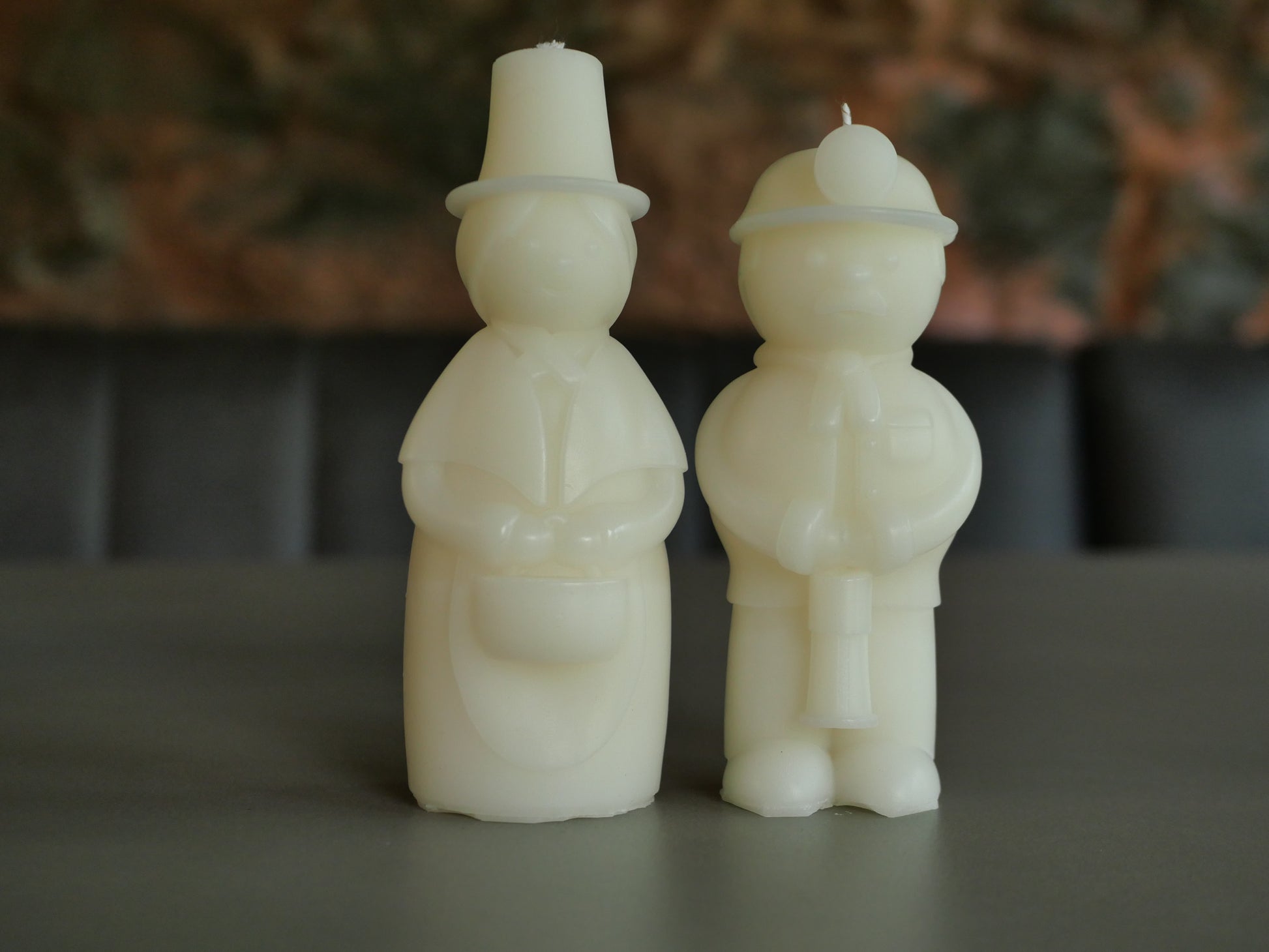Welsh Lady and Welsh Miner Candles in a creamy white wax colour