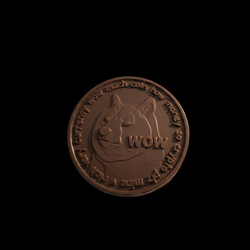 chocolate coin with a dog design and 'wow' text on a black background