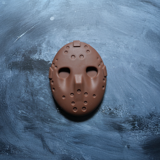 chocolate Jason hockey mask on a textured blue background