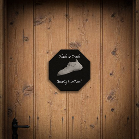 Octagonal sign with a climbing white shoe  and text on a wooden door