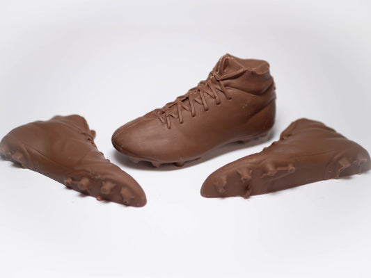 Football boots made out of chocolate.