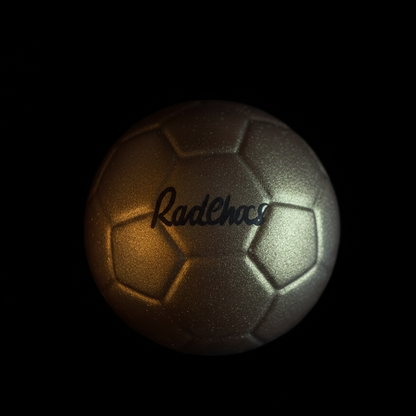 Metallic soccer ball with 'RadChaos' branding on a black background